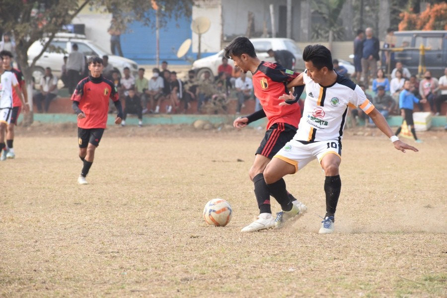 Phiban of Winfield (red) fights for the ball against Vikholie of MVYO(white) at the ongoing Frolic Cup.