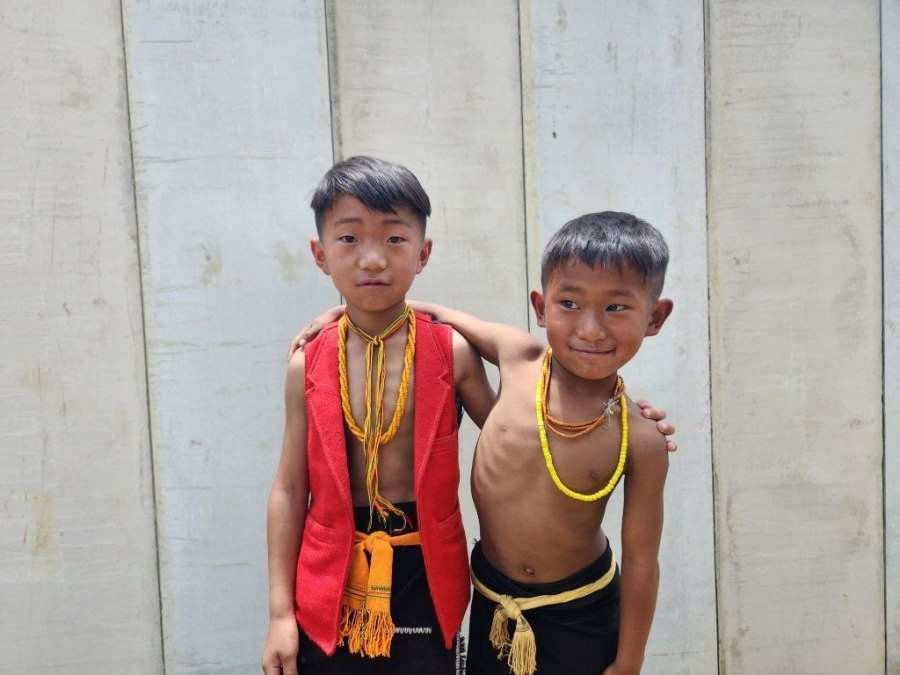 Two young boys in their traditional attires during the event of pre-celebration cum Monolith Stone Pulling in commemoration of the 75th anniversary of Christianity in Phusachodumi village on April 29.