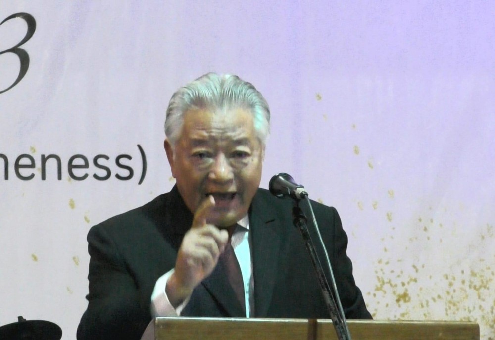Retired Chief Secretary, Alemtemshi Jamir speaking at the 2023 Mokokchung District College Students Confluence.