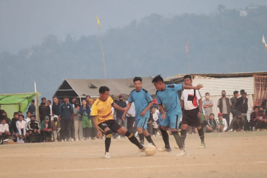 Players of Chozuba Area Sports Association (yellow jersey) and Tizu Area Sports Association (blue) in action during the second semifinal match at Chozuba on April 14.