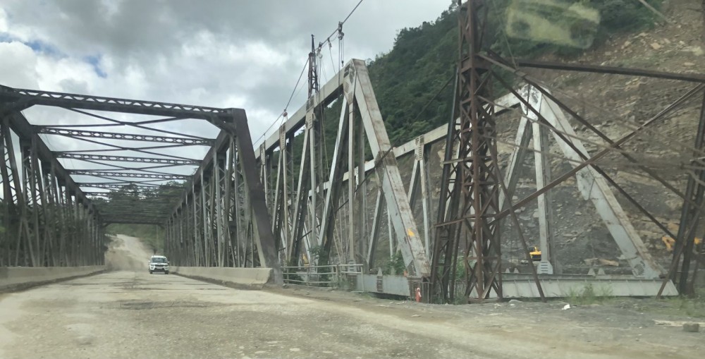 In this photo taken October 2022, a vehicle is passing through the old Bailey bridge near Peducha, while construction of a new bridge is being undertaken. Part of Package-III of the ongoing National Highway-29 Dimapur-Kohima four-lane project, works on the stretch have been hampered by various problems. (Morung File Photo)