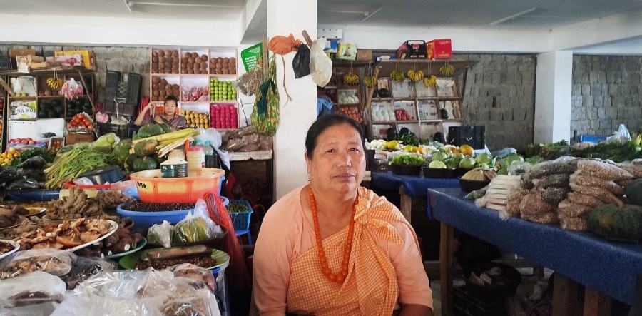 54-year-old YouTuber, Soneinuo seen at T Khel Sokhriezie Market, where she sells vegetables for a living. (Morung Photo)