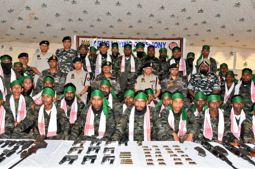 The surrendered APLA cadres with Assam Rifles, Assam Police and CRPF officials at the surrender ceremony in Bokajan Police Station, Karbi Anglong on June 2.