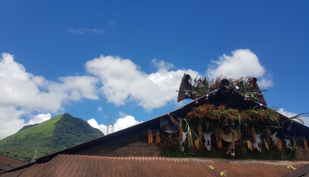 The iconic Teyozwu mountain, Viswema with a typical Naga house decorated during Te-L khukhu.