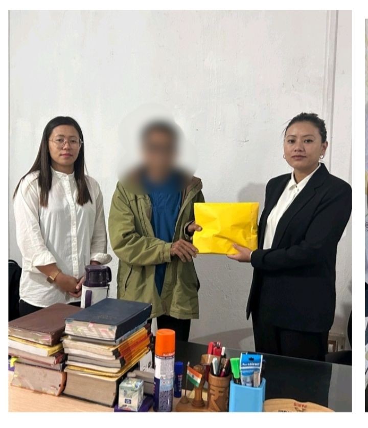 Victim compensation cheques being handed to dependent of victim by DLSAs in the month of June.