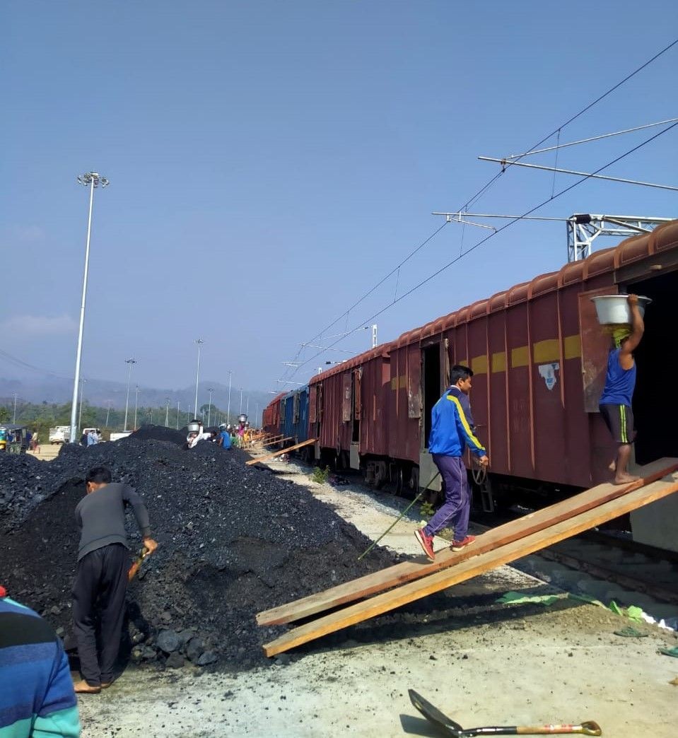 In this photo provided by the NFR, workers are seen loading coal at a railways station under its jurisdiction. (Morung Photo via NFR Handout)