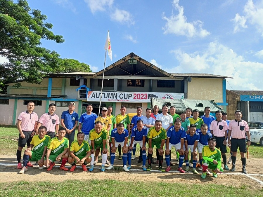 Players of Tsiepama YST (yellow & green) and Team Medziphema (blue) with the Match Patron Avitsi Nakhro.