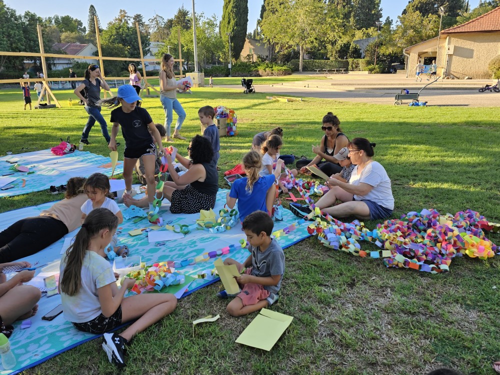 Kibbutz En Hashofet. Everyone helping to decorate the community Sukkah Tent, for the feast of Tabernacle, one week before the 7th of October 2023 terror attack. (Photo credit: Batya Reznik)