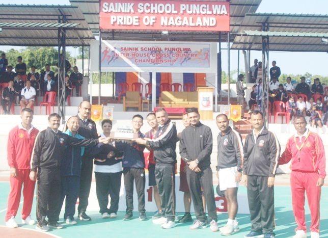 Sainik School Punglwa Principal and Chief Guest, Colonel Arvind Nautiyal gives away medals, certificates trophies to the winners of the Inter-House Cross Country Championship held on November 4. (Photo Courtesy: SSP)