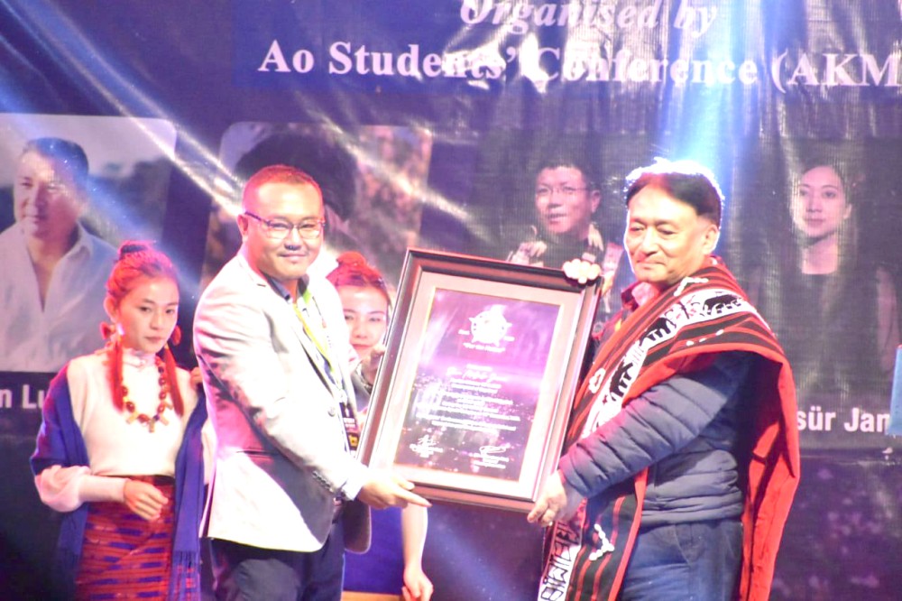 Minister Metsubo Jamir being felicitated by AKM officials during the fifth edition of We Care concert held at Imkongmeren Sports Complex on December 12.