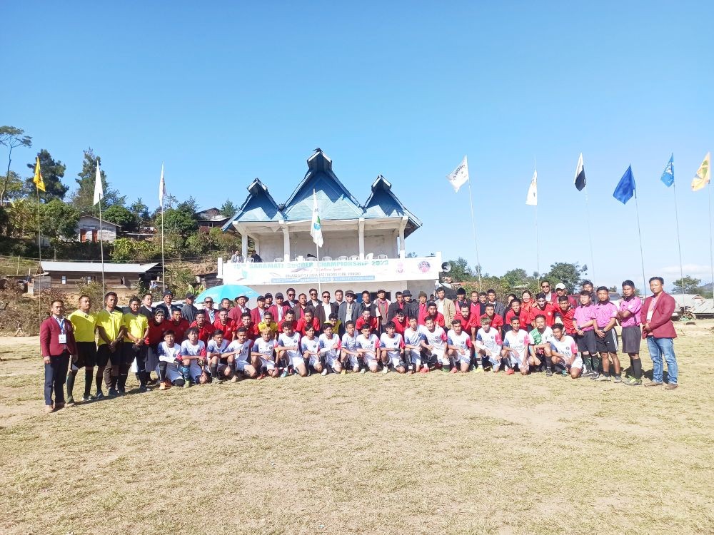 Champion Surayin FC team with runner-up team Falcon FC, referees, organizers and dignitaries at Pungro local ground on December 16.