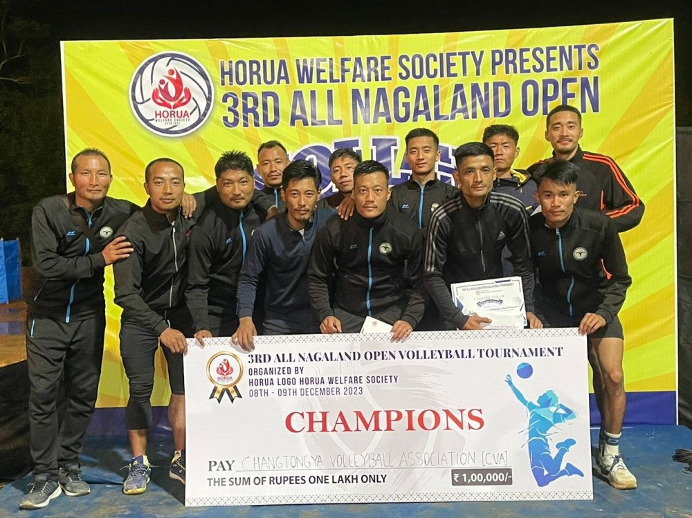 Players of the Changtongya Volleyball Association, the Team Manager, and the Coach pose for the camera after winning the final match of the 3rd All Nagaland Open Volleyball Tournament held at Indisen Public Ground on December 9. (Morung Photo)