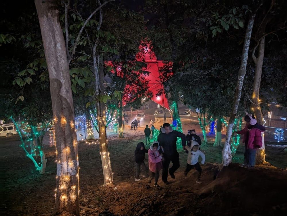 Tis the Season: Christmas revellers seen taking pictures and admiring the decorations put up at Indisen village, Dimapur on December 22. (Morung Photo)