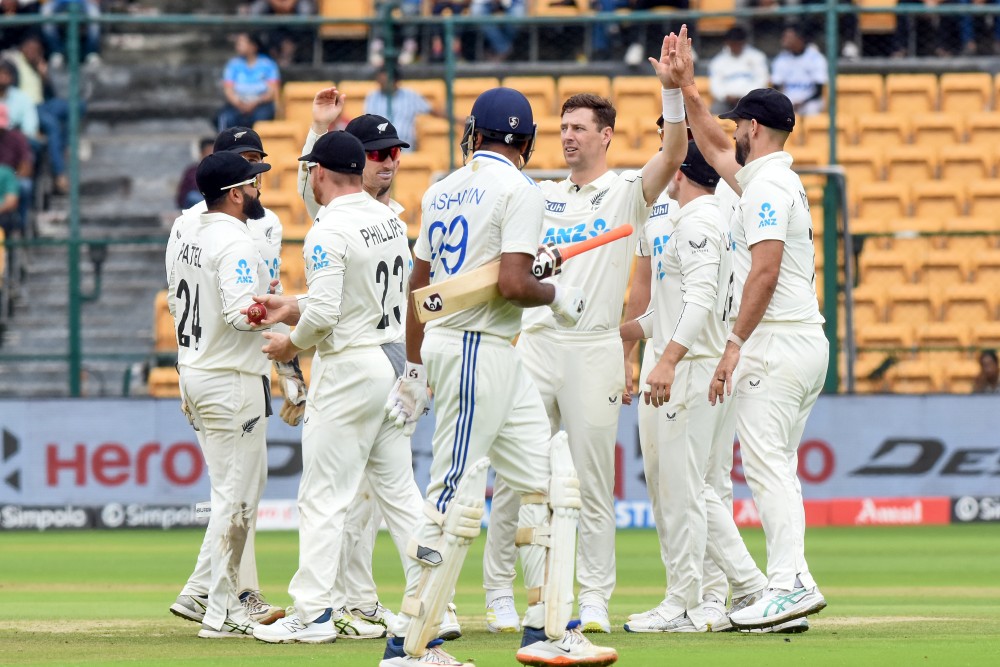 New Zealand's Matt Henry celebrates with teammates after taking the wicket of India's Ravichandran Ashwin on day two of the first cricket Test match between India and New Zealand at the M. Chinnaswamy Stadium in Bengaluru on Thursday, October 17, 2024. (Photo: IANS/Dhananjay Yadav)