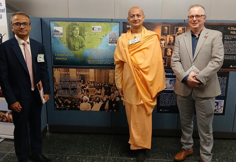 (Seen at the inauguration of the Vivekananda Exhibition at the United Nations are from left, India’s Consul General Binaya Srikanta Pradhan, Swami Sarvarpriyananda of the Vedanta Society, and Peter Dawkins, the president of the UN Staff Recreation Council. Photo: Arul Louis/IANS)