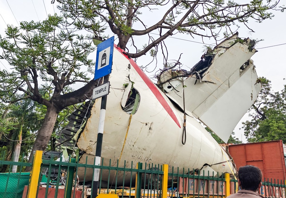 A truck transports the wreckage of the Air India plane that crashed into a medical hostel and canteen complex, in Ahmedabad, Gujarat, on Sunday, June 22, 2025. (Photo: IANS)