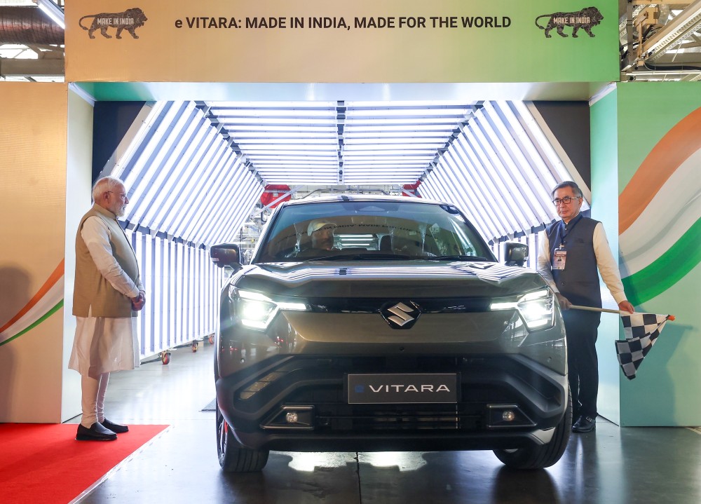 Prime Minister Narendra Modi with Toshihiro Suzuki, President & Representative Director of Suzuki Motor Corporation during the flagging off of the 'eVITARA', Suzuki’s first global strategic Battery Electric Vehicle (BEV), at the Suzuki Motor plant at Hansalpur, Ahmedabad, Gujarat, Tuesday, August 26, 2025. (IANS/PMO File Photo)