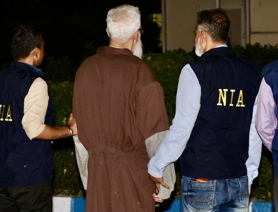 National Investigation Agency (NIA) arrests Tahawwur Hussain Rana, the key conspirator in the deadly 26/11 Mumbai terror attacks, immediately after his arrival at IGIA , following his successful extradition from the United States, in New Delhi on Thursday, April 10,2025. (IANS File Photo)