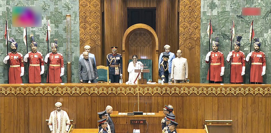 President Droupadi Murmu greets members as she arrives to address a joint sitting of both Houses of Parliament as the Budget Session commences, in New Delhi on Wednesday, January 28, 2026. (Photo: IANS/Video Grab/Sansad TV)